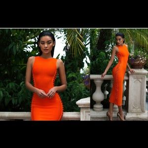 Houseofcb orange midi dress. Side cut out details on both sides.